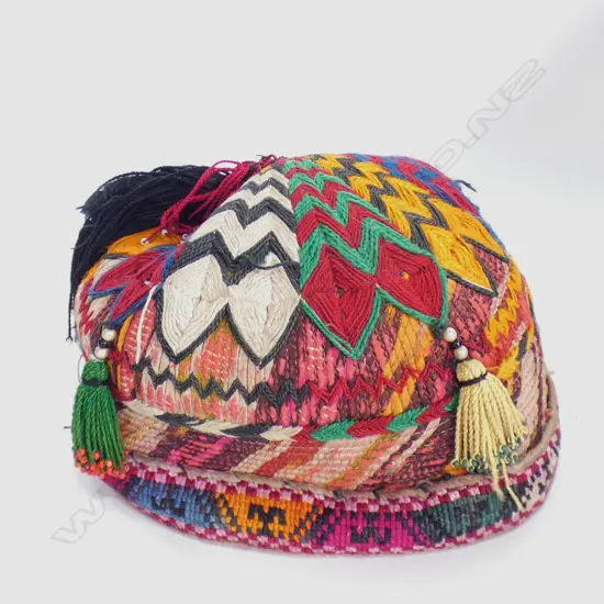 multi-coloured Uzbek skull cap with plait flap & tassels.